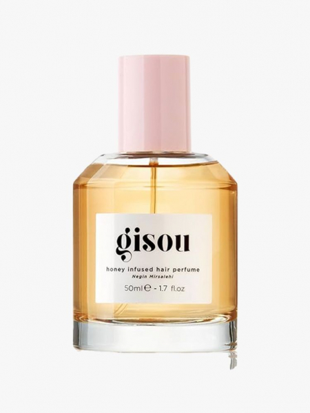 A bottle of Gisou Honey Infused Hair Perfume on a light gray background